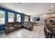 Open concept living room with tile floors, cozy seating, and natural light at 1110 Rose Blossom Ct, Tampa, FL 33613