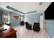 Living room features tile floors, blue accent walls, recessed lighting, and modern furniture at 1110 Rose Blossom Ct, Tampa, FL 33613
