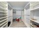 Large walk-in closet provides ample storage with adjustable shelving and organizational space at 1110 Rose Blossom Ct, Tampa, FL 33613