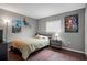 Comfortable bedroom featuring wood floors and modern decor at 12280 Waco St, Spring Hill, FL 34609