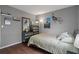 Cozy bedroom with wood-look floors, gray walls, and unique decor at 12280 Waco St, Spring Hill, FL 34609