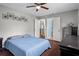 Cozy bedroom featuring wood floors, neutral walls, and ample closet space at 12280 Waco St, Spring Hill, FL 34609