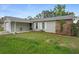 Charming single-story home with a combination of stone facade and landscaped yard at 12280 Waco St, Spring Hill, FL 34609