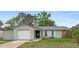 Charming single-story home featuring a well-maintained lawn and attached one-car garage at 12280 Waco St, Spring Hill, FL 34609