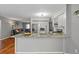 Open-concept kitchen with granite countertops and seamless flow to the living area at 12280 Waco St, Spring Hill, FL 34609
