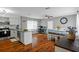 Bright and airy kitchen featuring stainless steel appliances, an island, and a dining area at 12280 Waco St, Spring Hill, FL 34609