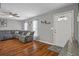Inviting living room with hardwood floors, a comfortable sectional sofa, and natural light at 12280 Waco St, Spring Hill, FL 34609