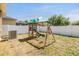 A play structure in the backyard creates a fun and Gathering-friendly outdoor space at 12519 Safari Ln, Riverview, FL 33579