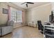 Comfortable room with a window for natural light, neutral paint, and modern home office setup at 12519 Safari Ln, Riverview, FL 33579