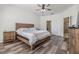 Spacious bedroom featuring wood floors, a ceiling fan and a neutral color palette at 12519 Safari Ln, Riverview, FL 33579