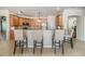 Kitchen featuring bar seating, tile floors, wood cabinets and neutral countertops at 12519 Safari Ln, Riverview, FL 33579