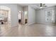 Open-concept living area with tile flooring and views into multiple rooms, offering spacious living at 12519 Safari Ln, Riverview, FL 33579