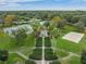 Park area features a walking path, tennis courts, and sand volleyball, providing residents with recreational activities at 12519 Safari Ln, Riverview, FL 33579