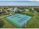 Aerial view of tennis courts close to the pool and other recreational areas makes for fun for residents at 12519 Safari Ln, Riverview, FL 33579
