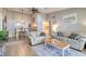 Cozy living room featuring comfortable seating, modern decor, and an adjacent dining area at 1309 Pine Ridge E Cir # H3, Tarpon Springs, FL 34688