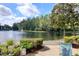 Beautiful water view with a fountain, serene lake, and lush greenery at 1309 Pine Ridge E Cir # H3, Tarpon Springs, FL 34688