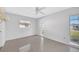 Bedroom has tile floors, ceiling fan and multiple windows allowing natural light at 13850 Sunset Dr, Largo, FL 33774