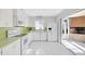 Kitchen with all white appliances offers lots of storage and prep space at 13850 Sunset Dr, Largo, FL 33774