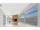 Bright sunroom featuring a stone fireplace, ceiling fan, and large windows for natural light at 13850 Sunset Dr, Largo, FL 33774