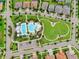 Aerial view of community pool with a long lap pool and a uniquely shaped recreational pool at 14241 Natures Reserve Dr, Lithia, FL 33547