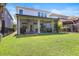 Screened patio and green fenced backyard ideal for outdoor living and entertaining at 14241 Natures Reserve Dr, Lithia, FL 33547
