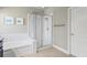 Bathroom featuring a shower with white subway tile and glass door enclosure at 14241 Natures Reserve Dr, Lithia, FL 33547