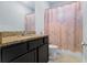 Bathroom features granite countertop, vanity, and shower with curtain at 14241 Natures Reserve Dr, Lithia, FL 33547