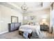 Bedroom with soft carpeting, neutral palette, and large window letting in plenty of natural light at 14241 Natures Reserve Dr, Lithia, FL 33547