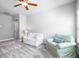 Bonus room with neutral tones, plush seating, and plenty of natural light at 14241 Natures Reserve Dr, Lithia, FL 33547