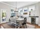 Bright dining area with custom cabinets, a wine refrigerator, and a view of the outdoors at 14241 Natures Reserve Dr, Lithia, FL 33547