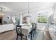 Light-filled dining room features custom cabinets and views of the backyard at 14241 Natures Reserve Dr, Lithia, FL 33547