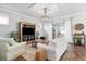 Inviting living room with comfortable seating and views of the outdoor patio at 14241 Natures Reserve Dr, Lithia, FL 33547