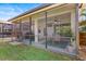 Inviting screened patio featuring a ceiling fan, outdoor seating, and relaxing backyard views at 14241 Natures Reserve Dr, Lithia, FL 33547