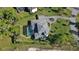 This property features a screened pool, playground, mature landscaping, and circular drive at 16121 Carencia Ln, Odessa, FL 33556