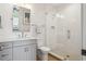 Modern bathroom featuring a white vanity, a toilet, and a glass-enclosed shower at 16121 Carencia Ln, Odessa, FL 33556