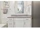 Bathroom vanity featuring a gray countertop, white cabinetry, and modern fixtures at 16121 Carencia Ln, Odessa, FL 33556
