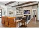 Spacious living room featuring built-in shelving, a cozy fireplace, and hardwood floors at 16121 Carencia Ln, Odessa, FL 33556