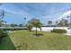 Spacious backyard, perfect for entertaining and relaxation, features lush landscaping and privacy fencing at 16315 2Nd E St, Redington Beach, FL 33708