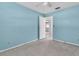 Bedroom with blue walls and an open doorway leads to another room at 16315 2Nd E St, Redington Beach, FL 33708