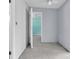 Bedroom with open door offering view to bedroom with a ceiling fan at 16315 2Nd E St, Redington Beach, FL 33708