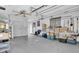 Tidy garage with shelving, storage, and overhead lighting at 16315 2Nd E St, Redington Beach, FL 33708