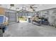 Spacious garage with ample storage shelving and high ceilings at 16315 2Nd E St, Redington Beach, FL 33708