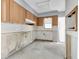 Bright kitchen with cabinets and a backsplash, offering a modern and efficient cooking space at 16315 2Nd E St, Redington Beach, FL 33708