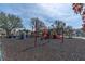 Colorful playground with slides, swings, and climbing structures surrounded by soft ground cover at 16315 2Nd E St, Redington Beach, FL 33708