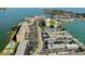 Community aerial view showcasing the neighborhood layout, landscaping, and ample parking spaces at 1847 Shore Drive South # 308, South Pasadena, FL 33707
