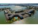 Stunning aerial view of the waterfront community, featuring a resort-style pool and lush landscaping at 1847 Shore Drive South # 308, South Pasadena, FL 33707