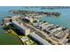 Gorgeous aerial view showcases waterfront living and building amenities including the swimming pool at 1847 Shore Drive South # 308, South Pasadena, FL 33707