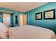 Bedroom boasts a white bed with marine-themed pillows and ensuite access at 1847 Shore Drive South # 308, South Pasadena, FL 33707