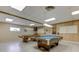 Well-lit billiards room with two tables and ample space for residents to enjoy a game of pool at 1847 Shore Drive South # 308, South Pasadena, FL 33707