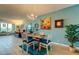 Inviting dining area with chandelier, art, and access to a view at 1847 Shore Drive South # 308, South Pasadena, FL 33707
